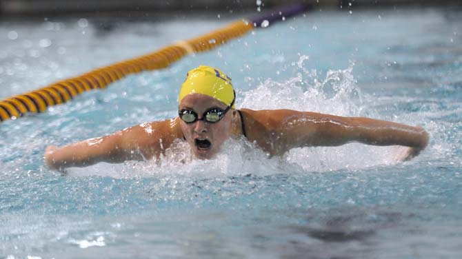 LSU freshman Sophie Weber takes a breath during the women's 100 yard butterfly event on Friday October 18, 2013 at the LSU vs. Georgia swim meet in the Natatorium.