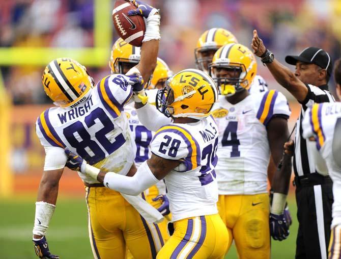 LSU senior wide receiver James Wright (82) celebrates with his teammates Wednesday, January 1, 2014 after a successful play during the Tigers' 21-14 victory against Iowa in the Outback Bowl at Raymond James Stadium in Tampa, Florida.