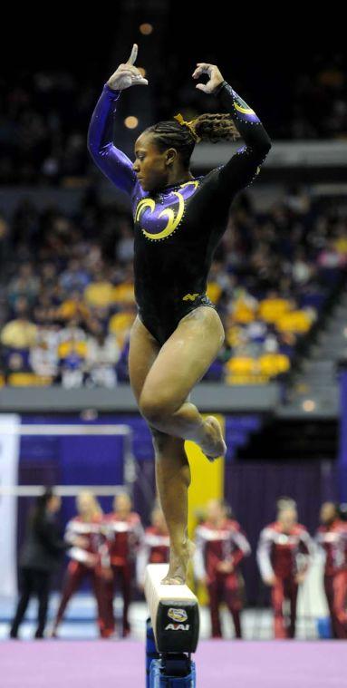 LSU junior all-around gymnast Lloimincia Hall spins on the beam Friday, Jan. 31, 2014 during the Tigers' 197.650-196.825 victory against Alabama in the PMAC.