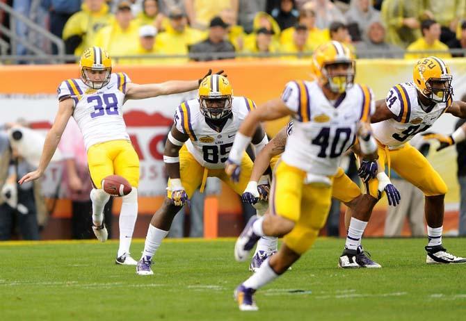 LSU sophomore punter Jamie Keehn (38) punts the ball Wednesday, January 1, 2014 during the Tigers' 21-14 victory against Iowa in the Outback Bowl at Raymond James Stadium in Tampa, Florida.