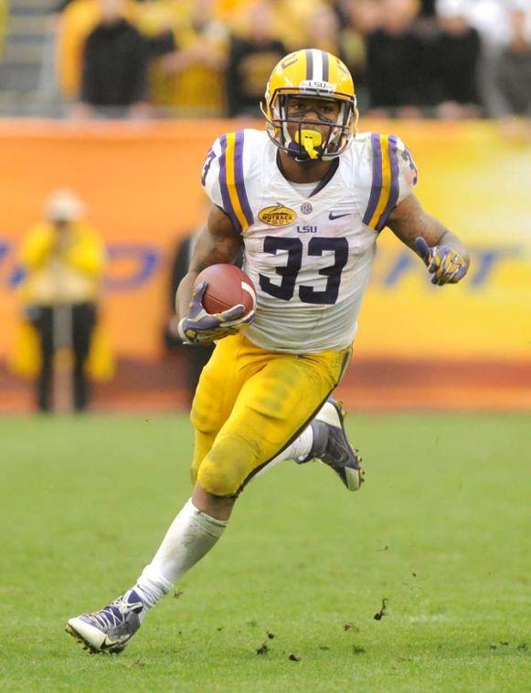 LSU sophomore running back Jeremy Hill (33) navigates downfield Wednesday, January 1, 2014 during the Tigers' 21-14 victory against Iowa in the Outback Bowl at Raymond James Stadium in Tampa, Florida.