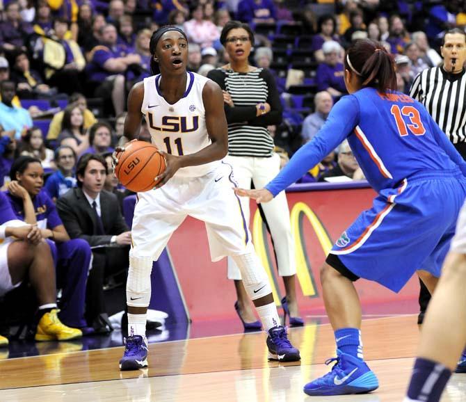 LSU freshman guard Raigyne Moncrief (11) looks for an open teammate Sunday, Jan. 12, 2014 during the Tigers 82-68 victory against Florida in the PMAC.