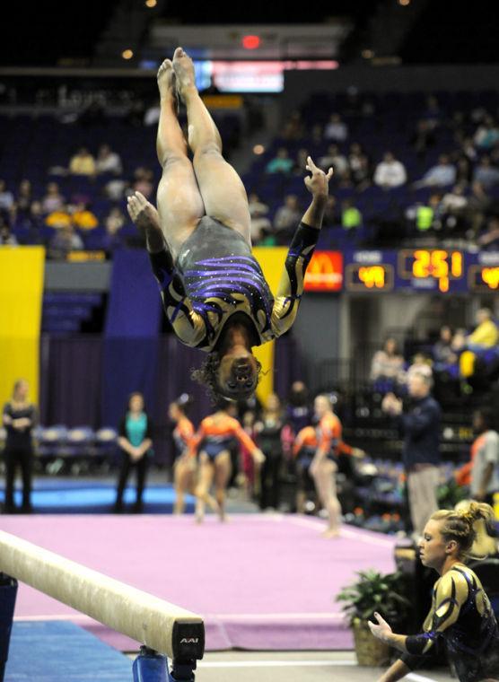 LSU Gymnist, Lloimincia Hall, performing on the balance beam at the LSU vs Auburn Gym meet on 1.25.14