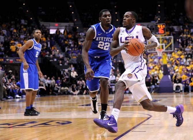 LSU senior forward Shavon Coleman (5) moves the ball down the court Tuesday, Jan. 28, 2014 during the Tigers' 87-82 victory against Kentucky.