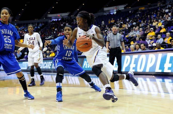 LSU freshman guard Raigyne Moncrief (11) dribbles the ball past Indiana State senior guard Bilqis Abdul-Qaadir (10) Tuesday, Dec. 2, 2013 during the Tigers' 83-66 victory against the Sycamores in the PMAC.