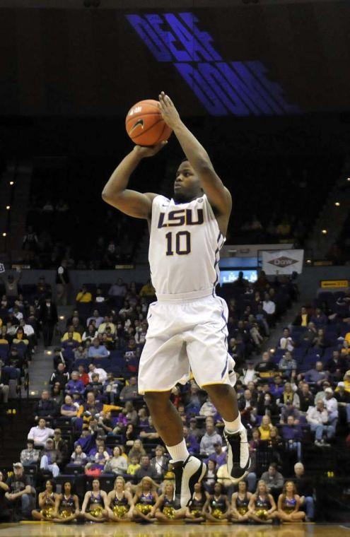 LSU senior guard Andre Stringer (10) tries for a three-pointer Saturday, Jan. 4, 2014 during the Tigers' 70-74 loss to Rhode Island in the PMAC.