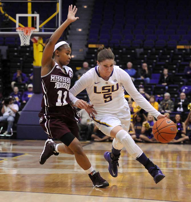 LSU senior guard Jeanne Kenny (5) dribbles up the court Thursday, Jan. 30, 2013 during the Lady Tigers' 65-56 victory against Mississippi State in the PMAC.