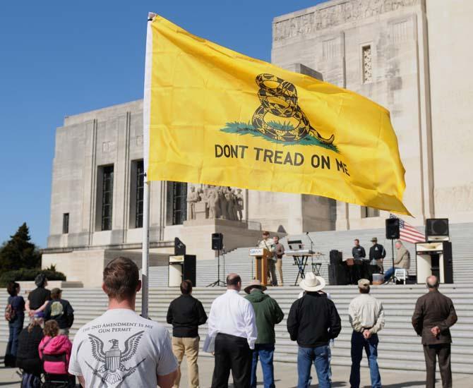 Supporters of gun rights listen to speakers Sunday, Jan. 19, 2014 at the Gun Rights Across America rally in front of the Louisiana state capitol building.