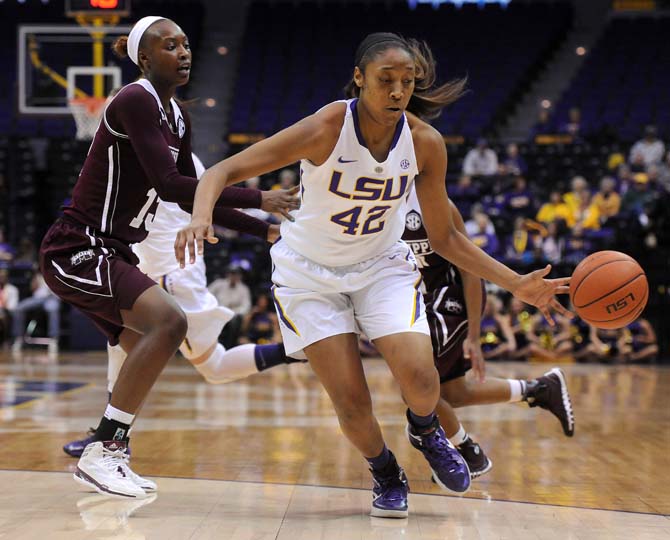 LSU junior forward Sheila Boykin (42) attempts to maneuver past Mississippi State freshman forward Ketara Chapel (13) on Thursday, Jan. 30, 2013 during the Lady Tigers' 65-56 victory against Mississippi State in the PMAC.