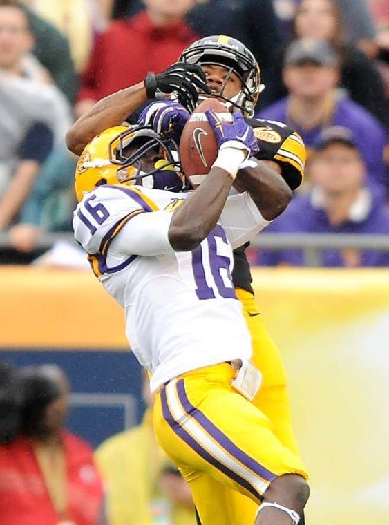 LSU freshman defensive back Tre'Davious White (16) intercepts an Iowa deep ball Wednesday, January 1, 2014 during the Tigers' 21-14 victory against Iowa in the Outback Bowl at Raymond James Stadium in Tampa, Florida.