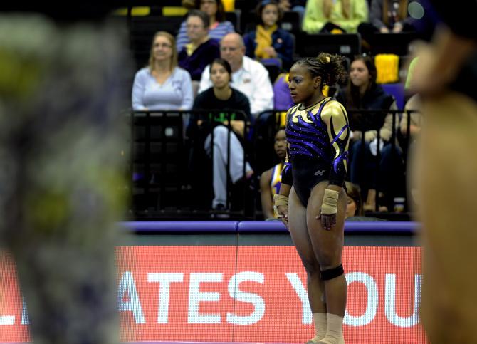 LSU Gymnist, Lloimincia Hall, preparing to perform her fl oor routine at the LSU vs Auburn Gym Meet at the PMAC on 1.25.14