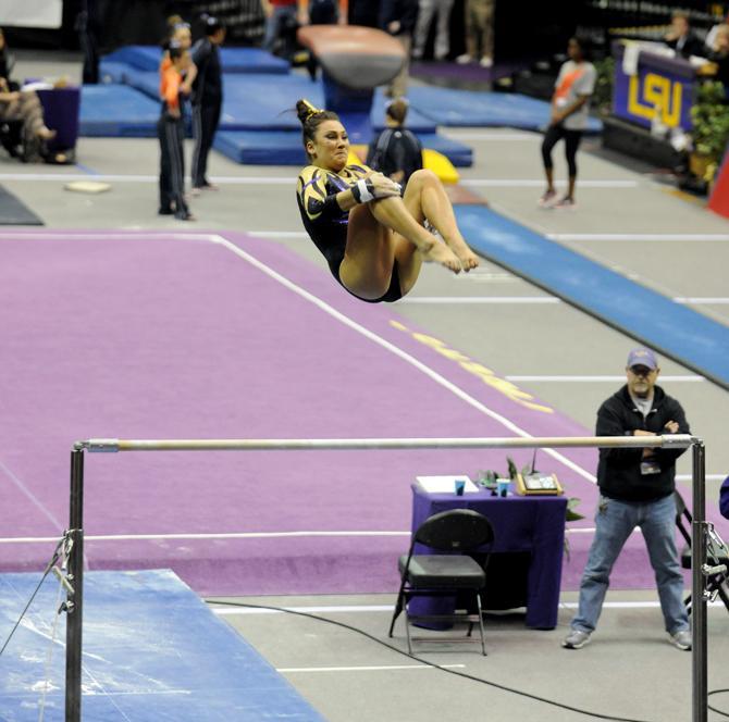 LSU Gymnist, Jessica Savona, coming out of her bar routine at the LSU vs Auburn Gym Meet on 1.25.14 in the PMAC.