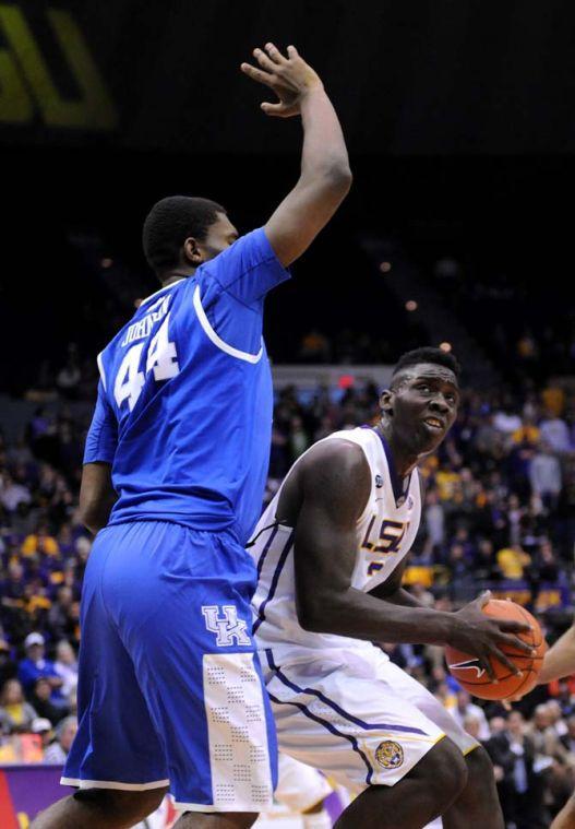 LSU junior forward Johnny O'Bryant III (2) attempts to move past a Kentucky defender Tuesday, Jan. 28, 2014 during the Tigers' 87-82 victory against the Wildcats.