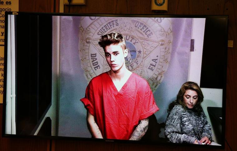 Justin Bieber appears in court via video feed, Thursday, Jan. 23, 2014, in Miami. Bieber was released from jail Thursday following his arrest on charges of driving under the influence, driving with an expired license and resisting arrest. Police say they stopped the 19-year-old pop star while he was drag-racing down a Miami Beach street before dawn. (AP Photo/The Miami Herald, Walter Michot, Pool)