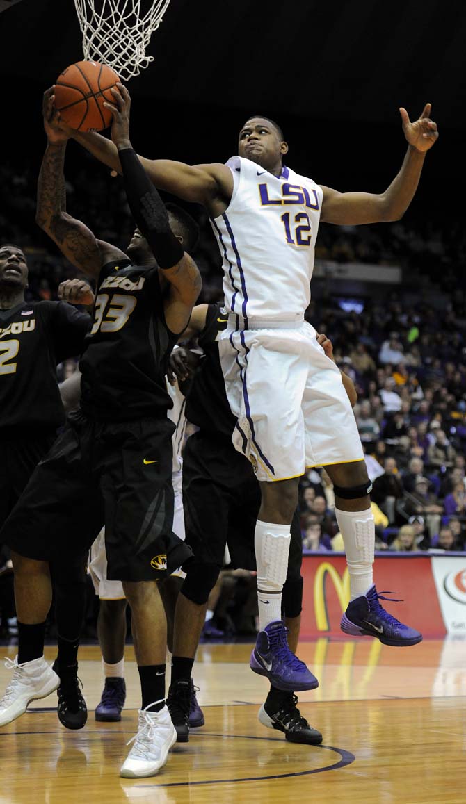 LSU freshman forward Jarell Martin (12) rebounds Tuesday, Jan. 21, 2014, during the Tigers' 77-71 win against Mizzou in the PMAC.