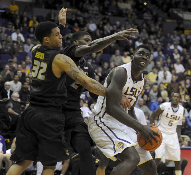 LSU junior forward Johnny O'Bryany III (2) dribbles around Missouri defenders Tuesday, Jan. 21, 2014, during LSU's 77-71 win against Mizzou in the PMAC.