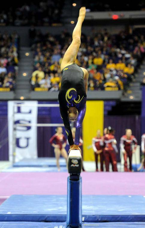 LSU junior all-around gymnast Jessie Jordan flips on the beam Friday, Jan. 31, 2014 during the Tigers' 197.650-196.825 victory against Alabama in the PMAC.