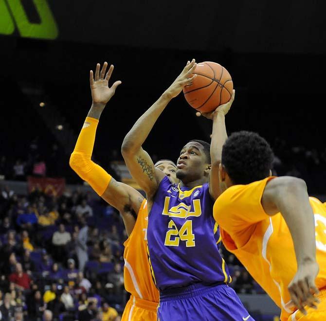 LSU sophomore guard Malik Morgan (24) weaves through Tennessee defenders Tuesday, Jan. 7 during the Tigers' 50-68 loss to the Volunteers in the PMAC.