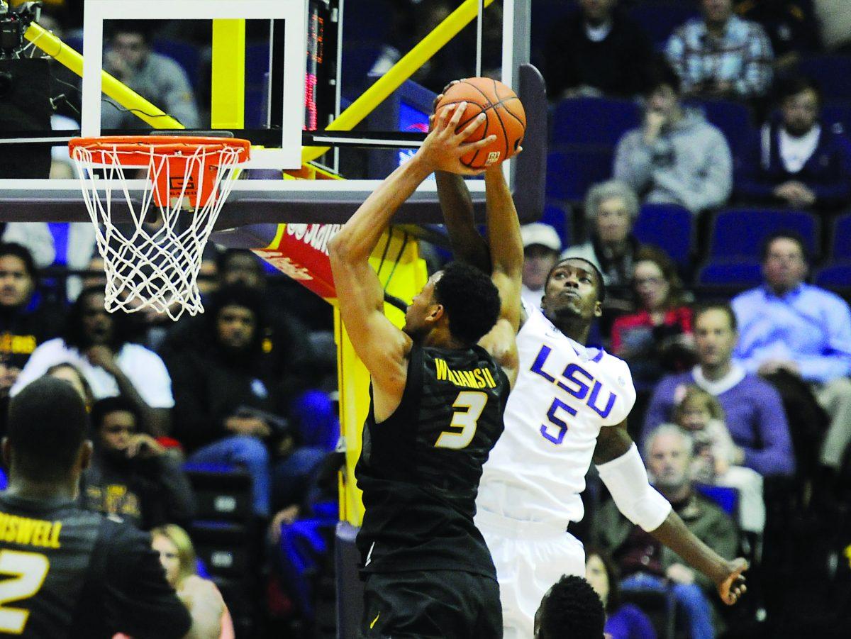 LSU senior forward Shavon Coleman (5) blocks a shot by Missouri's Jonathan Williams (3) in the first half of a game on Tuesday, Jan. 21, 2014 in the PMAC. LSU leads Missouri 38-33 at the half.