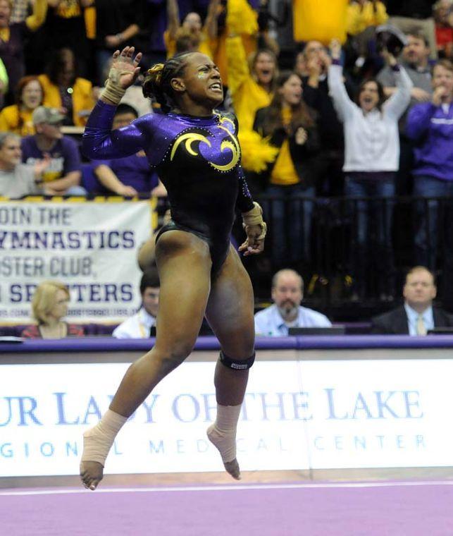 LSU junior all-around gymnast Lloimincia Hall celebrates after receiving a perfect 10 for her floor routine Friday, Jan. 31, 2014 during the Tigers' 197.650-196.825 victory against Alabama in the PMAC.