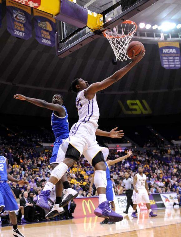LSU freshman forward Jordan Mickey (25) lays up the ball Tuesday, Jan. 28, 2014 during the Tigers' 87-82 victory against Kentucky.