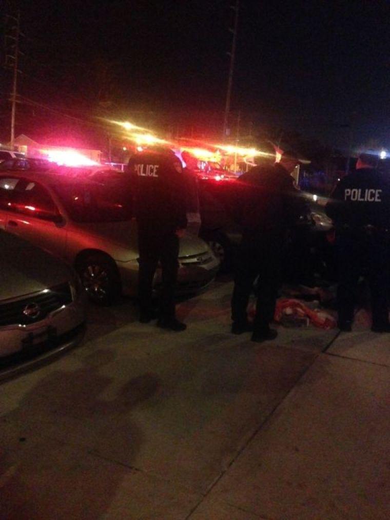 Baton Rouge Police officers gather evidence from the scene.