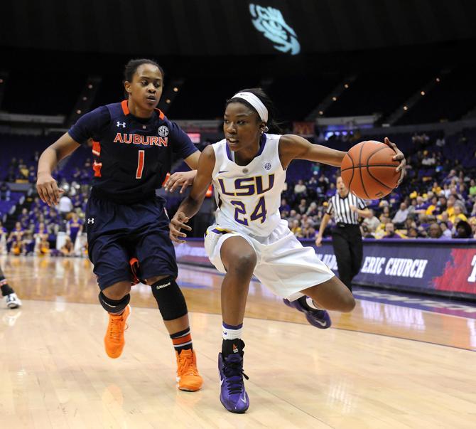 LSU junior guard DaShawn Harden (24) attempts to evade Auburn freshman guard Meagan Tucker (1) on Thursday, Jan. 23, 2013 during the Lady Tigers' 71-60 victory against Auburn in the PMAC.