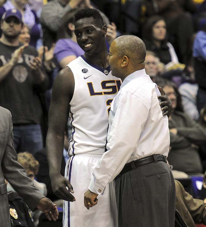 LSU basketball coach Johnny Jones celebrates with junior Johnny O'Bryant III (2) on Tuesday, Jan. 21, 2014, during the Tigers' 77-71 win against Mizzou in the PMAC. O'Bryant had 16 points and 6 rebounds in the game.