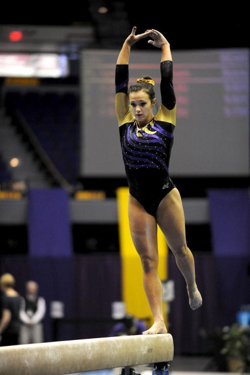 LSU Gymnist, Ashleigh Gnat, performing her balance beam routine at the LSU vs Auburn Gym Meet at the PMAC on 1.25.14