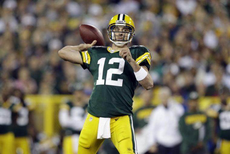 Green Bay Packers' Aaron Rodgers throws during the second half of an NFL football game against the Chicago Bears Thursday, Sept. 13, 2012, in Green Bay, Wis. (AP Photo/Jeffrey Phelps)