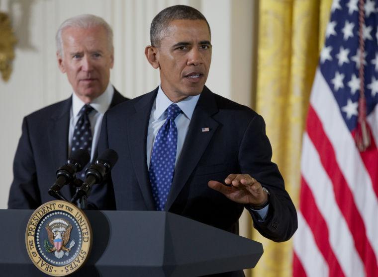 President Barack Obama, accompanied by Vice President Joe Biden, speaks in the East Room of the White House in Washington, Wednesday, Jan. 22, 2014, before the president signed a memorandum creating a task force to respond to campus rapes during an event for the Council on Women and Girls. (AP Photo/Carolyn Kaster)