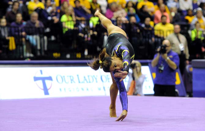 LSU sophomore all-around gymnast Jessica Savona flips across the floor Friday, Jan. 31, 2014 during the Tigers' 197.650-196.825 victory against Alabama in the PMAC.