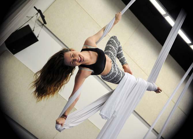 Theatre sophomore Devin Williams suspends herself on arial silks Friday, Jan. 17, 2014 in the Music and Dramatic Arts building.