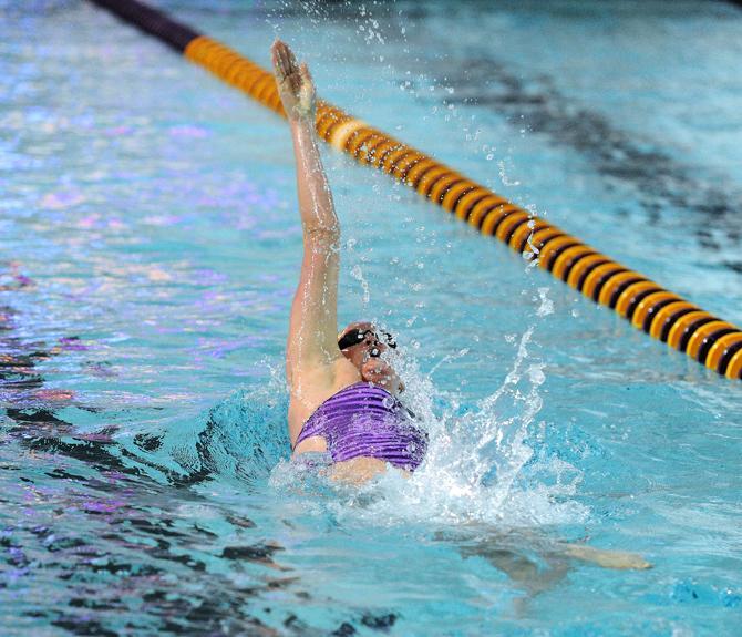 LSU senior swimmer Kyra Jones competes in the woman's 100 back time finals Saturday, Jan. 18, 2013 during the Tiger's meet against Texas A&amp;M in the LSU natatorium.