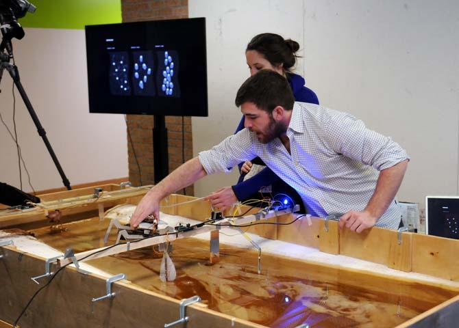 Ilya Lipov answers questions about a dredge model Thursday, Jan. 16, 2014 as part of the DredgeFest Louisiana symposium in the Design Building.