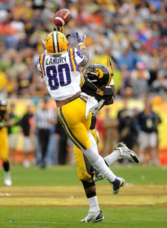 LSU junior wide receiver Jarvis Landry (80) leaps to catch a pass from freshman quarterback Anthony Jennings Wednesday, January 1, 2014 during the Tigers' 21-14 victory against Iowa in the Outback Bowl at Raymond James Stadium in Tampa, Florida.