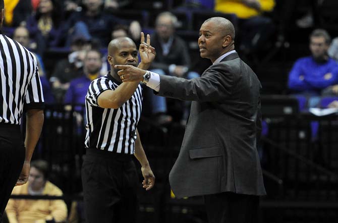 LSU head basketball coach Johnny Jones speaks to a referee Saturday, Jan. 18, 2014 during the Tigers' 81-58 victory against Vanderbilt in the PMAC.