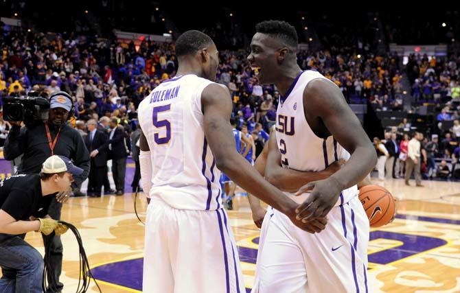 LSU junior forward Johnny O'Bryant III (2) hugs teammate senior forward Shavon Coleman (5) Tuesday, Jan. 28, 2014 after the Tigers' 87-82 victory against the Wildcats.