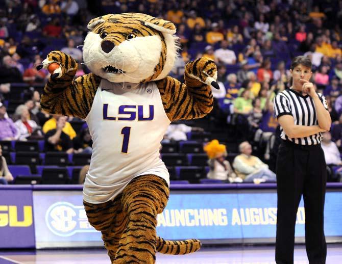 LSU mascot Mike the Tiger flexes his muscles Sunday, Jan. 12, 2014 during the Lady Tigers' 82-68 victory against Florida in the PMAC.