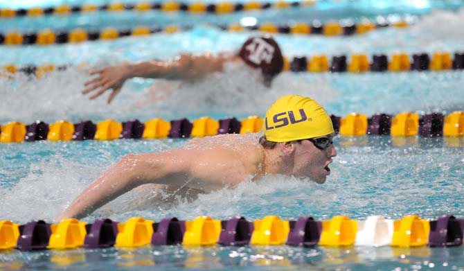 LSU freshman Eric Klein swims the butterfly leg of the men's 400 yard medley relay Saturday, Jan. 18, 2013 during the Tiger's meet against Texas A&amp;M in the LSU natatorium.