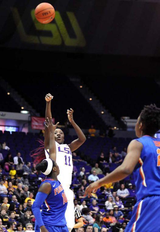 LSU freshman guard Raigyne Moncrief (11) launches the ball toward the net Sunday, Jan. 12, 2014 during the Tigers 82-68 victory against Florida in the PMAC.