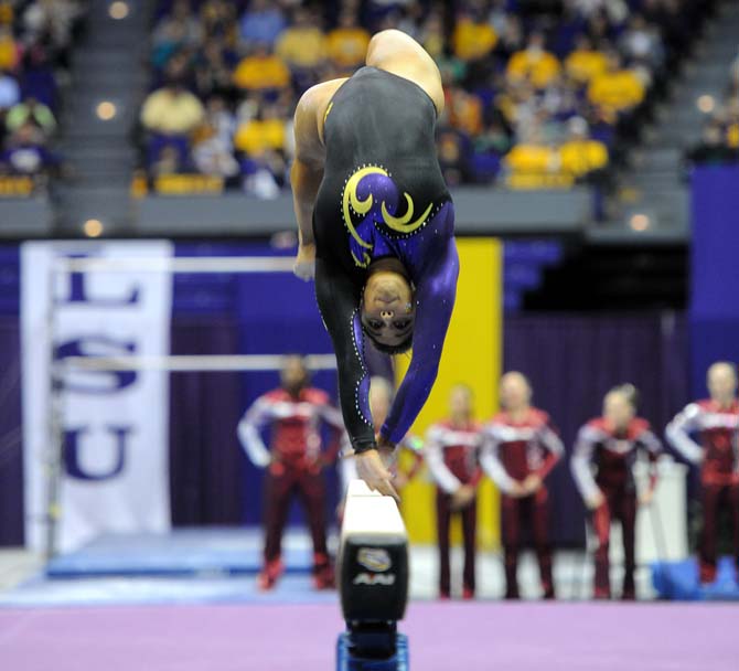 LSU sophomore all-around gymnast Jessica Savona flips on the beam Friday, Jan. 31, 2014 during the Tigers' 197.650-196.825 victory against Alabama in the PMAC.