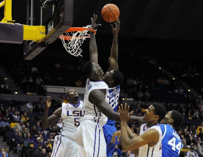 LSU junior forward Johnny O'Bryant III (2) tries to block a shot by Kentucky sophomore forward Alex Poythress (22) on Tuesday, Jan. 28, 2014, during the Tigers' 87-82 win against the Wildcats in the PMAC.