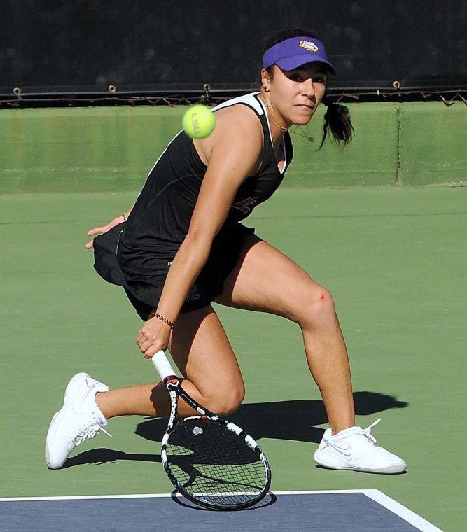 LSU freshman Joana Vale Costa hits the ball Sunday, January 19, 2014 during a match against Nicholls State University in W.T. "Dub" Robinson Stadium.