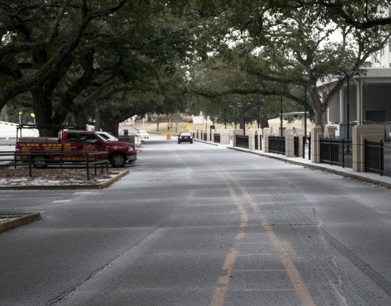 Ice begins to cover North Stadium Road on Tuesday, Jan. 28, 2014.