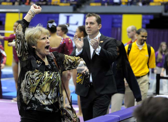 LSU gymnastics head coach D-D Breaux encourages fans to cheer Friday, Jan. 31, 2014 during the Tigers' 197.650-196.825 victory against Alabama in the PMAC.