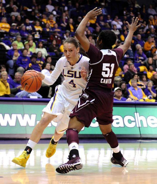 LSU sophomore guard Anne Pedersen (4) attempts to manuever past Mississippi State junior guard Savannah Carter (51) on Thursday, Jan. 30, 2013 during the Lady Tigers' 65-56 victory against Mississippi State in the PMAC.