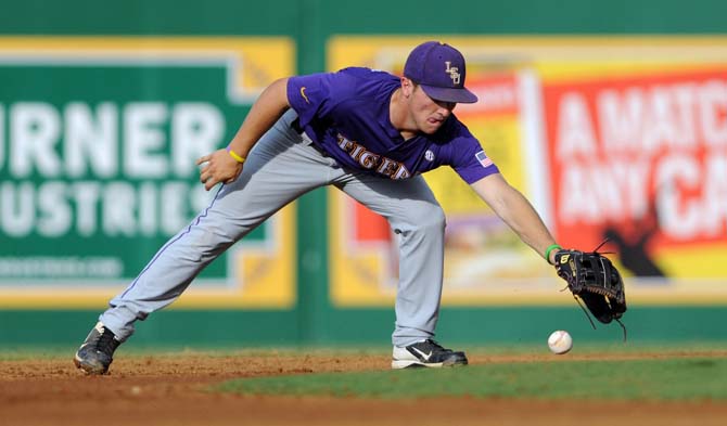 LSU freshman infielder Alex Bregman (30) reaches for the ball June 8, 2013 during the Tigers' 11-1 victory over Oklahoma in Alex Box Stadium.