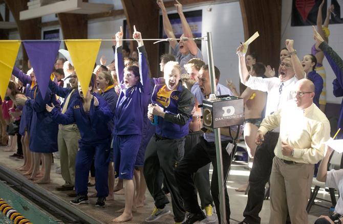 LSU swimming and diving team celebrates after a victory by the men's relay team Saturday, Jan. 18, 2013 during the Tiger's meet with Texas A&amp;M in the LSU natatorium.