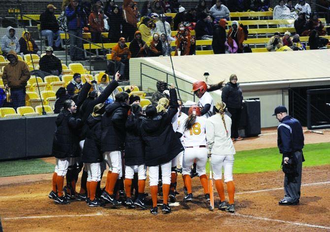 The Lady Longhorns' cheer for sophomore utility Lindsey Stephens as she racks up the second homerun for the Longhorns Thursday, Feb.6, 2014 as they defeat the LSU Lady Tigers 6-1.